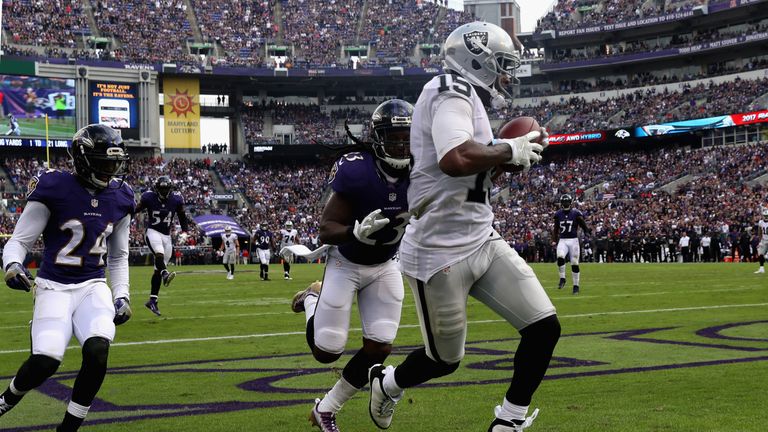 BALTIMORE, MD - OCTOBER 02: Michael Crabtree #15 of the Oakland Raiders catches a fourth quarter touchdown pass in front of Kendrick Lewis #23 and Kyle Arr