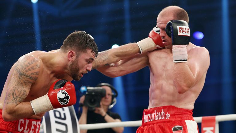 Juergen Braehmer ( ) of Germany exchanges punches with Nathan Cleverly of Wales