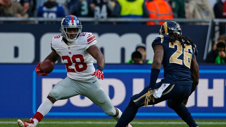 LONDON, ENGLAND - OCTOBER 23:  Paul Perkins #28 of the New York Giants runs the ball against Mark Barron #26 of the  Los Angeles Rams during the NFL Intern