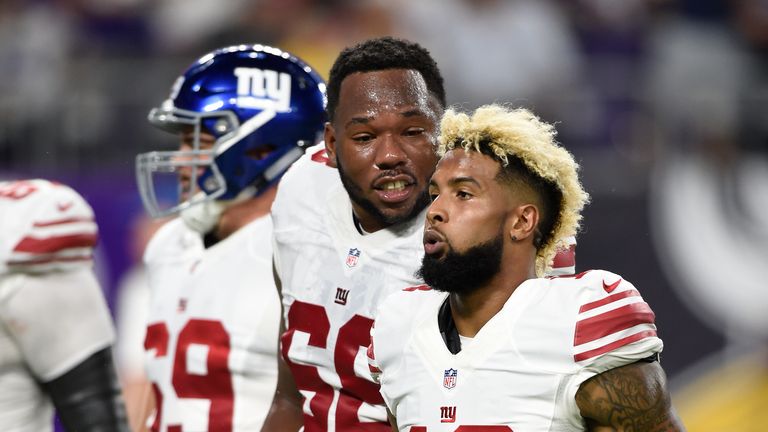 MINNEAPOLIS, MN - OCTOBER 3: Bobby Hart #68 of the New York Giants and teammate Odell Beckham #13 talk while walking off the field after the first half of 