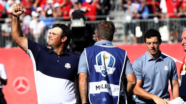 Patrick Reed of the United States celebrates on the 18th green after winning his match against Rory McIlroy