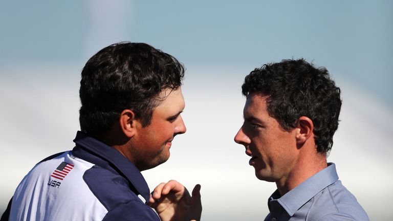 USA's Patrick Reed and Europe's Rory McIlroy shake hands after their round during the singles matches on day three of the 41st Ryder Cup at Hazeltine Natio