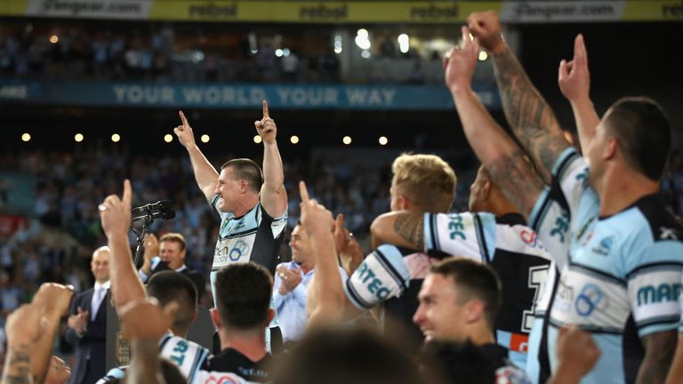 Sharks captain, Paul Gallen celebrates with team mates after winning the 2016 NRL Grand Final