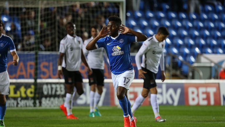 Peterborough's Shaquile Coulthirst celebrates after scoring against Northampton