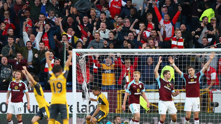 Arsenal players celebrate a late winner against Burnley at Turf Moor