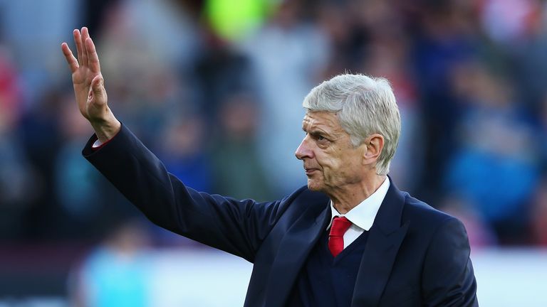 Arsene Wenger waves to fans prior to kick-off at Turf Moor