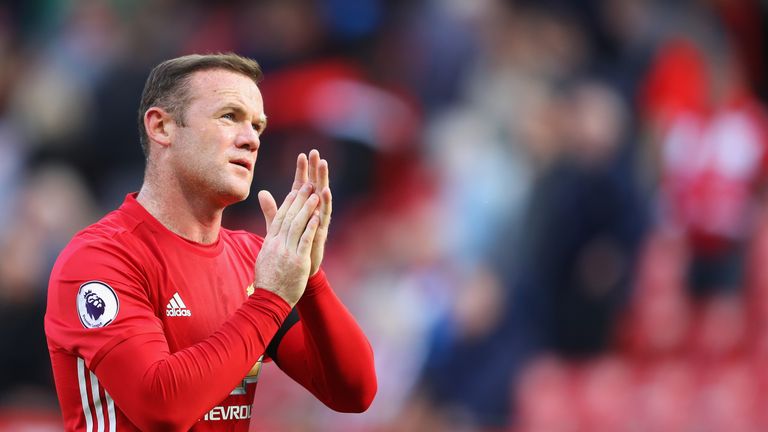 Wayne Rooney appluds the Old Trafford crowd after the game with Stoke City ends 1-1