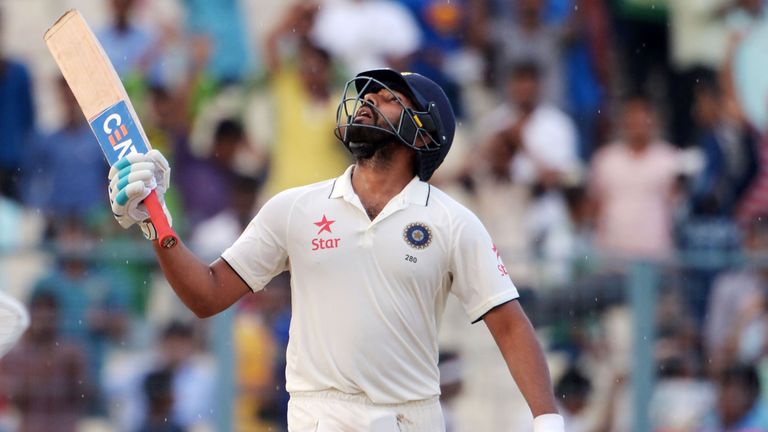India's Rohit Sharma celebrates after scoring a half-century (50 runs) during the third day of the second Test cricket match between India and New Zealand 