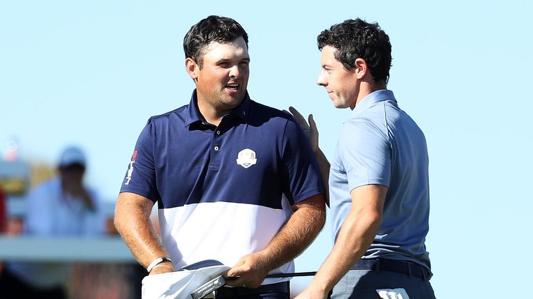 CHASKA, MN - OCTOBER 02:  Patrick Reed of the United States shakes hands with Rory McIlroy of Europe after Reed won their match during singles matches of t