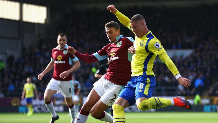 Ross Barkley shoots while under pressure from Matt Lowton 