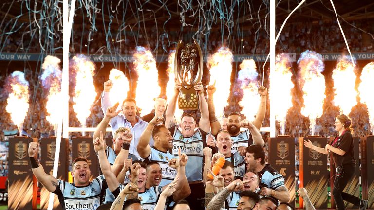 Sharks captain Paul Gallen lifts the premiership trophy after winning the 2016 NRL Grand Final