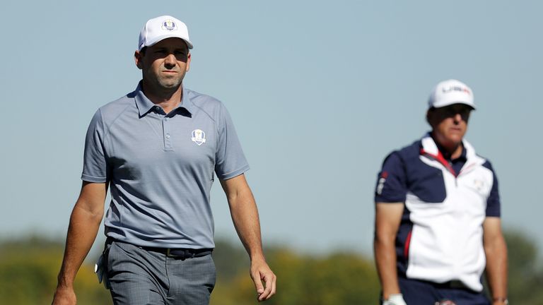 CHASKA, MN - OCTOBER 02: Sergio Garcia of Europe and Phil Mickelson of the United States walk off the third tee during singles matches of the 2016 Ryder Cu