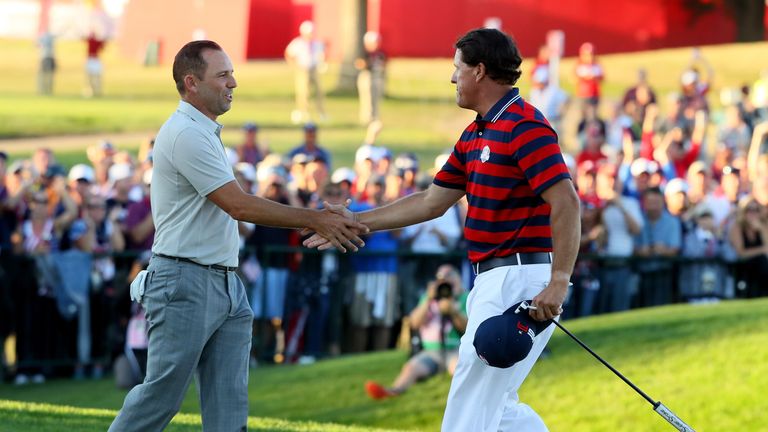 CHASKA, MN - OCTOBER 01:  Sergio Garcia of Europe and Phil Mickelson of the United States shake hands after the United States won their match on the 17th g