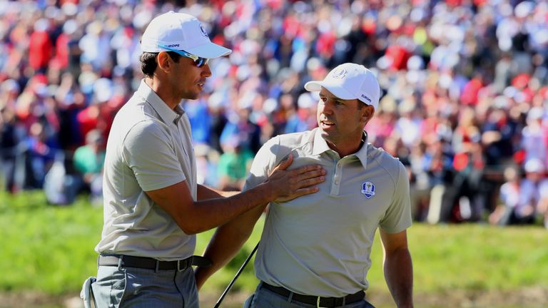 CHASKA, MN - OCTOBER 01:  Sergio Garcia of Europe reacts with Rafa Cabrera Bello to a putt on the 16th green during morning foursome matches of the 2016 Ry