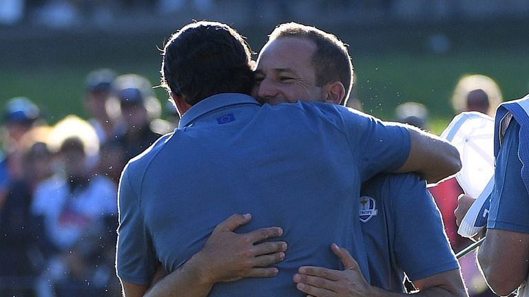 CHASKA, MN - SEPTEMBER 30: Rafa Cabrera Bello and Sergio Garcia of Europe hug after winning their match during afternoon fourball matches of the 2016 Ryder