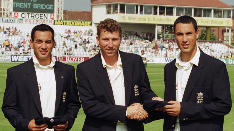 Adam Hollioake (left) and his brother Ben (right) collect their England caps from captain Mike Atherton