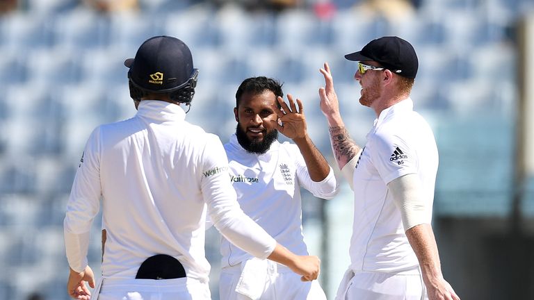 Adil Rashid celebrates dismissing Shafiul Islam during the 3rd day of the 1st Test match