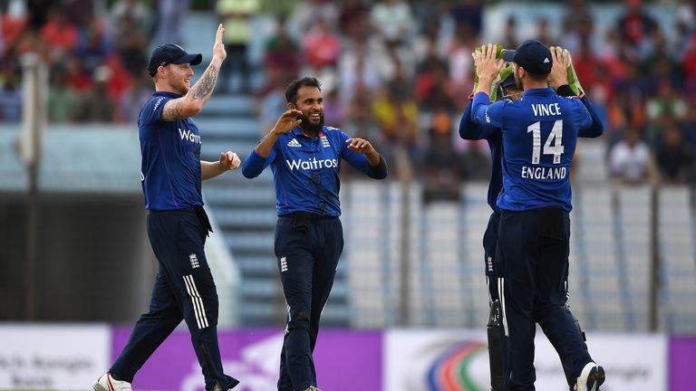 Adil Rashid of England celebrates with Ben Stokes and James Vince after dismissing Tamim Iqbal of Bangladesh