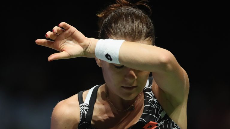 SINGAPORE - OCTOBER 24:  Agnieszka Radwanska of Poland reacts in her singles match against Svetlana Kuznetsova of Russia during the BNP Paribas WTA Finals 