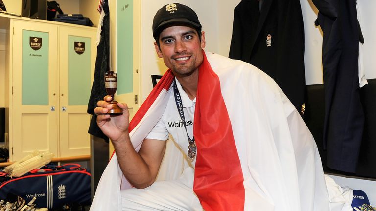 Cook celebrates winning back the Ashes urn in The Oval dressing room after a 3-2 win over Australia in 2015
