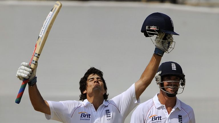 England cricket team captain Alastair Cook (L) reacts after scoring a century (100 runs) as teammate Kevin Pietersen (R) looks on during the first day of p