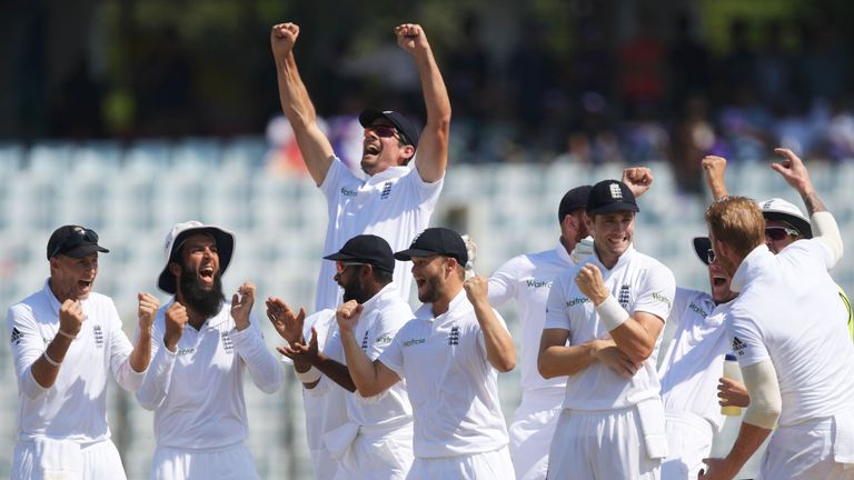 England's captain Alastair Cook (top 3rd L) celebrates with team-mates after beating Bangladesh