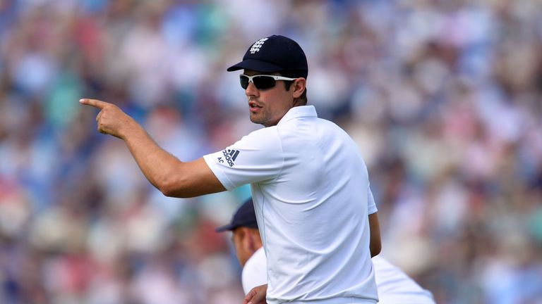 England's Alastair Cook positions his fielders