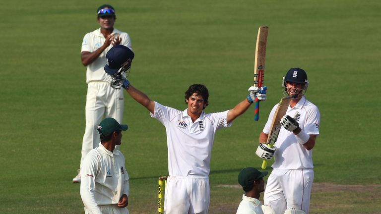 DHAKA, BANGLADESH - MARCH 24: England captain Alastair Cook raises his bat after reaching his century as Kevin Pietersen (r) applauds during day five of th