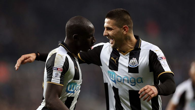 NEWCASTLE UPON TYNE, ENGLAND - OCTOBER 25: Mohamed Diame of Newcastle United (L) celebrates scoring his sides second goal with Aleksandar Mitrovic of Newca
