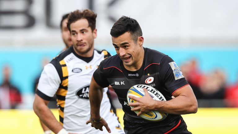 BARNET, ENGLAND - OCTOBER 09:  Alex Lozowski of Saracens moves away from Danny Cipriani during the Aviva Premiership match between Saracens and Wasps at Al