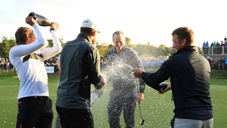WATFORD, ENGLAND - OCTOBER 16:  Alex Noren of Sweden celebrates on the 18th green following his victory during the fourth round of the British Masters at T
