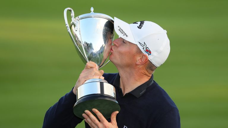 WATFORD, ENGLAND - OCTOBER 16:  Alex Noren of Sweden kisses the trophy following his victory during the fourth round of the British Masters at The Grove on