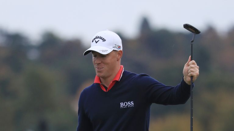 WATFORD, ENGLAND - OCTOBER 15:  Alex Noren of Sweden celebrates after holing a birdie putt on the 18th green during the third round of the British Masters 