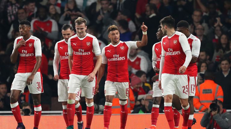 Arsenal's Alex Oxlade-Chamberlain celebrates with his team-mates after scoring his side's first goal 