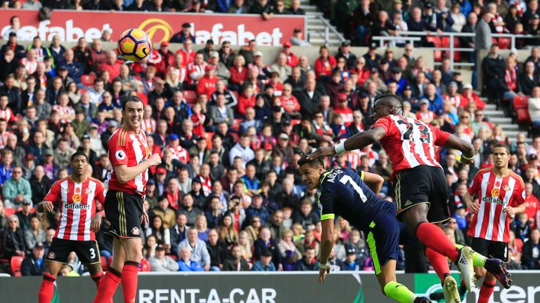 Arsenal striker Alexis Sanchez heads into the net against Sunderland