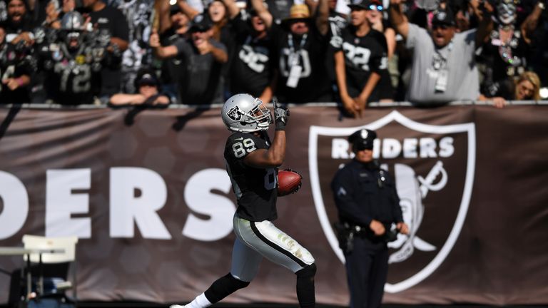 OAKLAND, CA - OCTOBER 09:  Amari Cooper #89 of the Oakland Raiders scores a 64-yard touchdown against the San Diego Chargers during their NFL game at Oakla