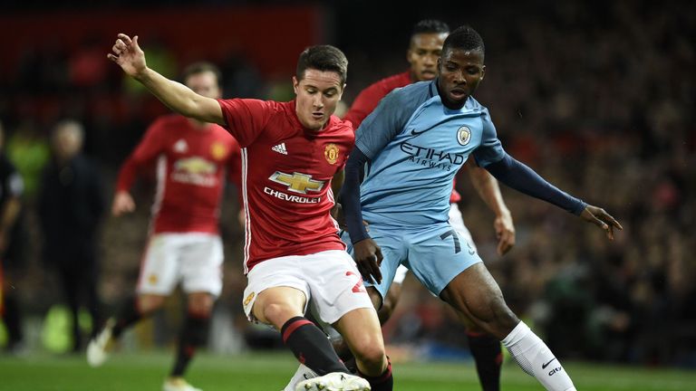 Manchester United midfielder Ander Herrera (L) vies with Manchester City striker Kelechi Iheanacho 