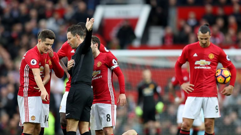 Ander Herrera of Manchester United protests to referee Mark Clattenburg after being sent off against Burnley