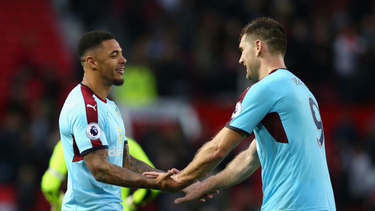 Andre Gray and Sam Vokes (right) celebrate a hard-earned point at Old Trafford