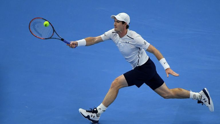 Andy Murray of Britain hits a return against Grigor Dimitrov of Bulgaria during the men's singles final at the China Open tennis tournament in Beijing on O