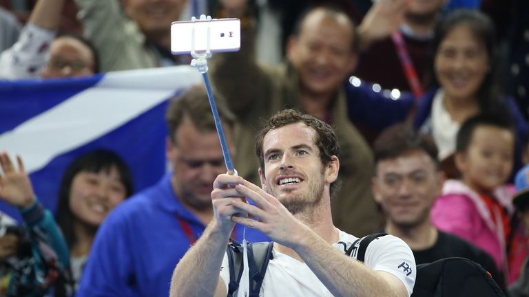 Andy Murray of Great Britain takes a slefie with fans