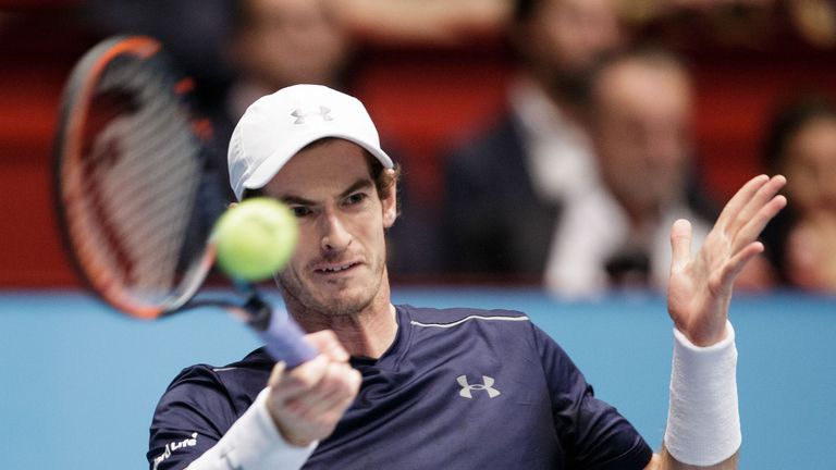 Andy Murray returns to John Isner during their quarter final match at the ATP tennis tournament in Vienna