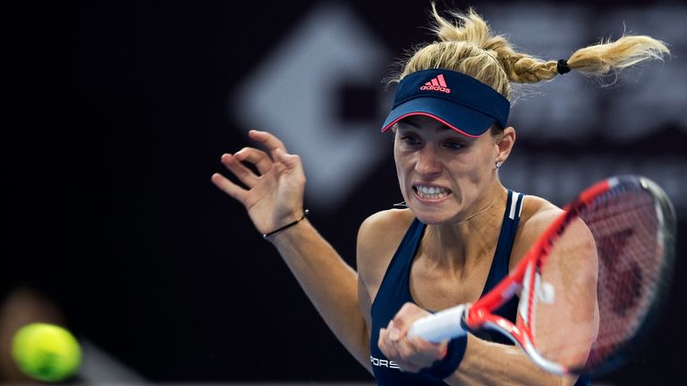 Angelique Kerber of Germany hits a return to Elina Svitolina of Ukraine during the women's singles third round of the China Open tennis tournament in Beiji