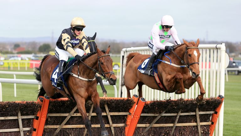Nichols Canyon ridden by Paul Townend (left) and Annie Power ridden by Ruby Walsh compete during the Doom Bar Aintree Hurdle in April 2016.