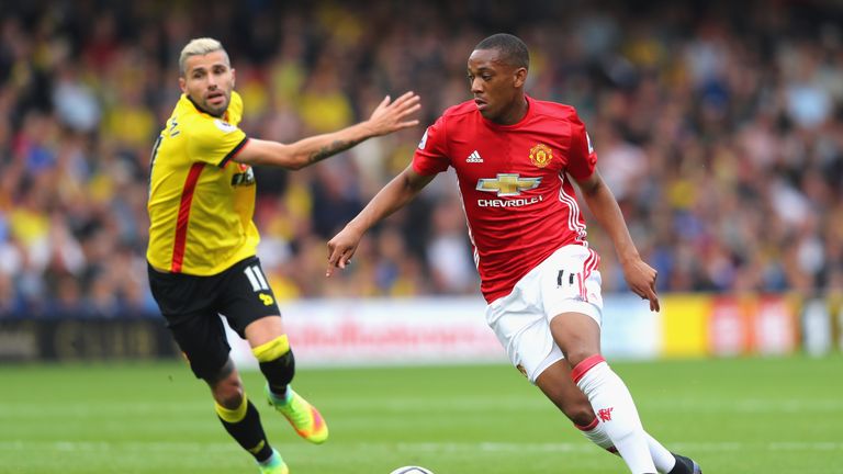 Anthony Martial of Manchester United takes the ball past Valon Behrami of Watford  during the Premier League match