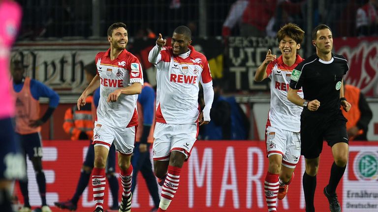 Cologne's French striker Anthony Modeste (C) and his teammates celebrate during the German first division Bundesliga football match between 1 FC Cologne an