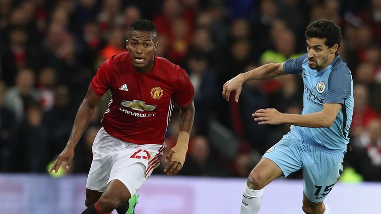 MANCHESTER, ENGLAND - OCTOBER 26:  Antonio Valencia (L) of Manchester United moves away from Jesus Navas during the EFL Cup Fourth Round match between Manc