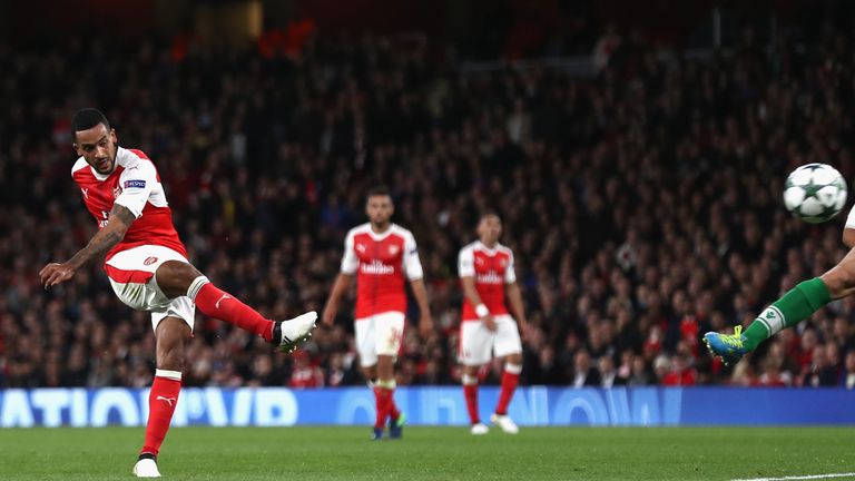 LONDON, ENGLAND - OCTOBER 19:  Theo Walcott of Arsenal scores his team's second goal of the game during the UEFA Champions League group A match between Ars