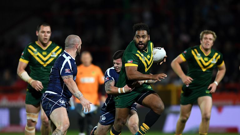 Sam Thaiday of Australia breaks throught the tackle of Liam Hood of Scotland 