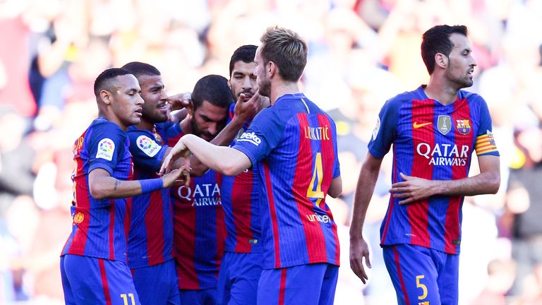 Barcelona's Rafinha (2nd left) celebrates with his team mates